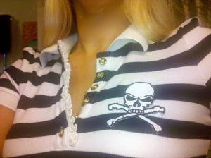 Juicy Couture collared striped shirt, $34.99. Skull and crossbones patch purchased at Michael's, $2.99. You don't have to be a sewing expert to adhere spice up your wardrobe. The patch shown is an iron on and takes less than five minutes to complete!